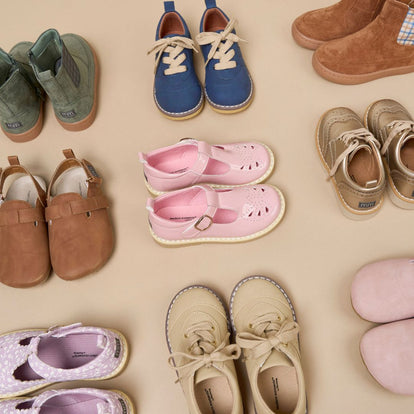  A circle of assorted baby shoes in various colors and styles, showcasing their adorable designs and tiny sizes